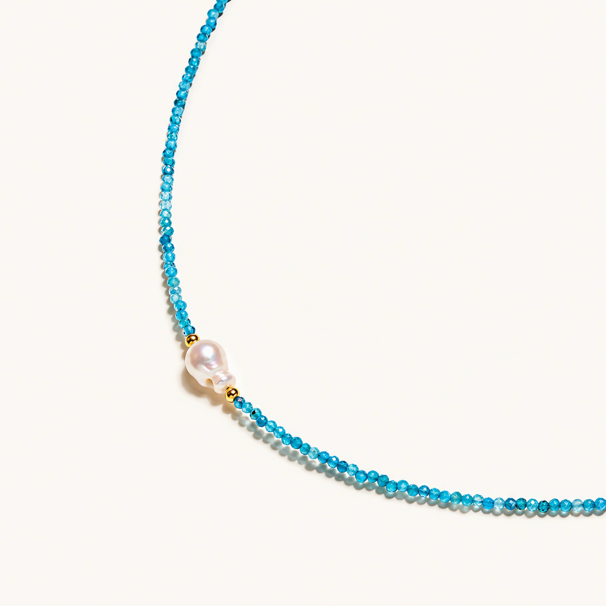 Blue apatite beaded necklace with a single freshwater pearl in the centre