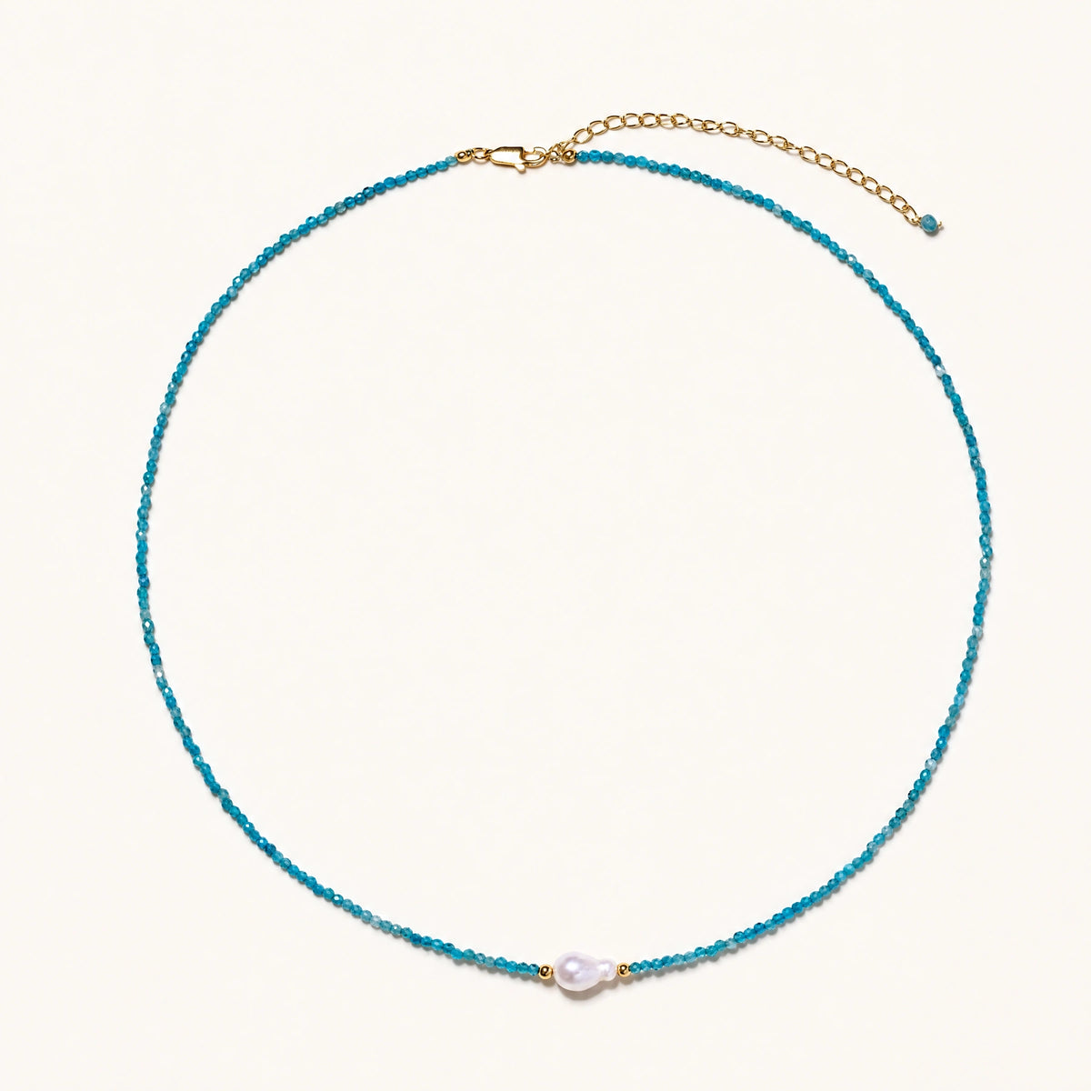 Blue apatite beaded necklace with a single freshwater pearl in the centre