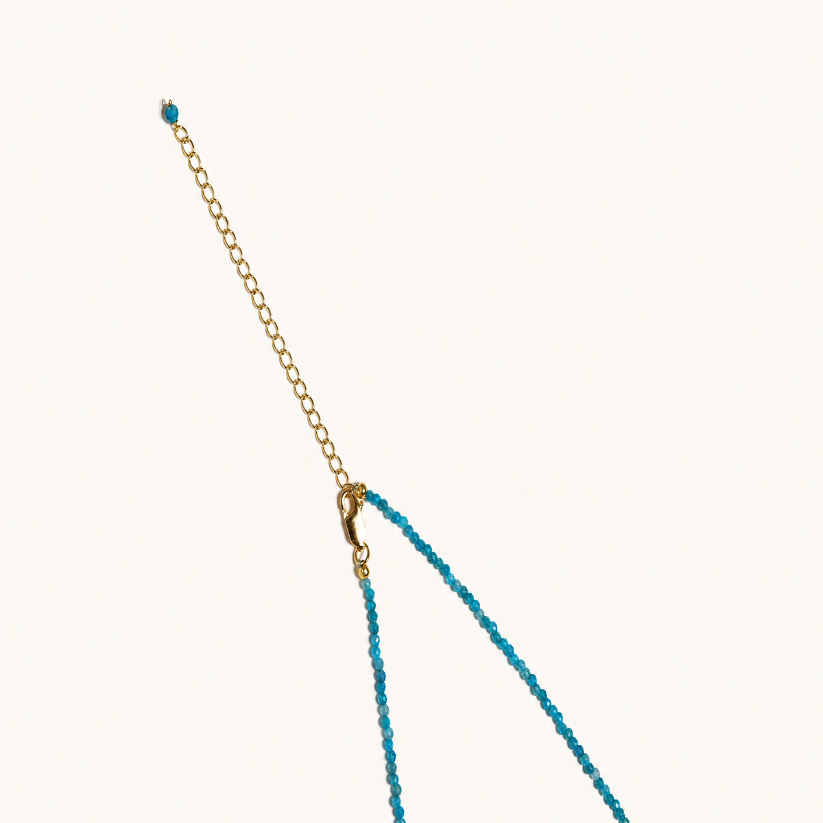 Blue apatite beaded necklace with a single freshwater pearl in the centre