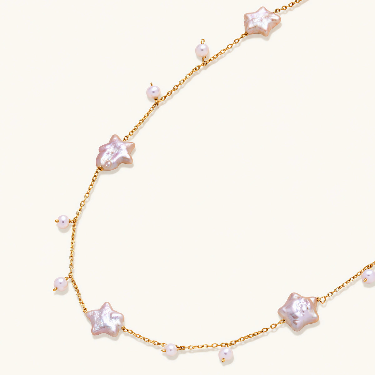 Vermeil chain with star-shaped baroque pearls and small round freshwater pearl drops