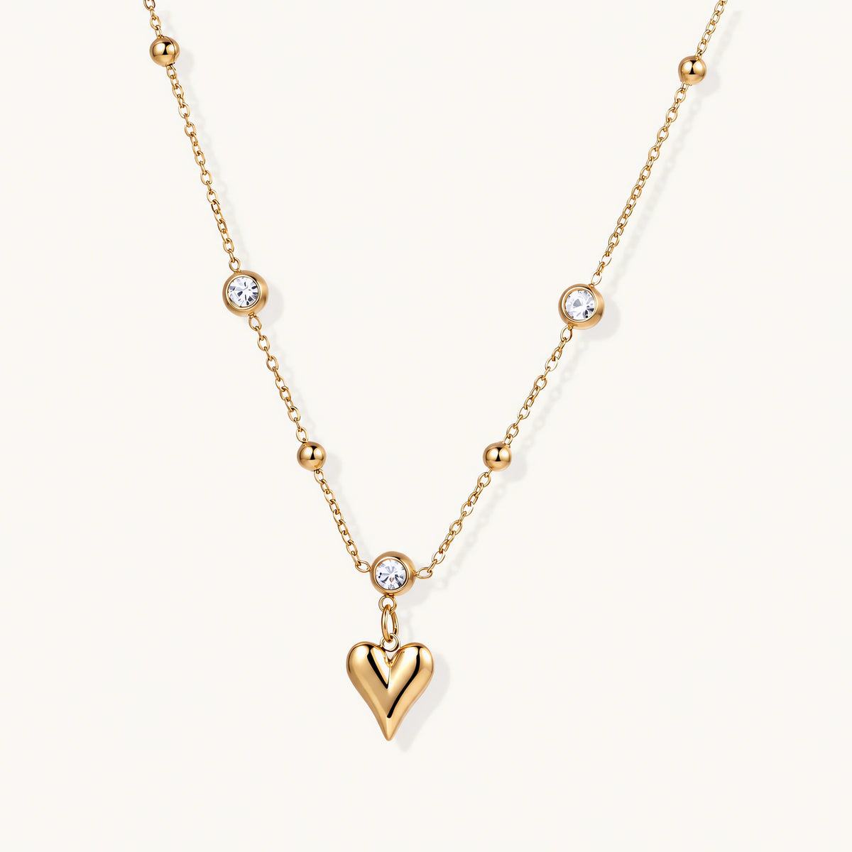Fine chain set with small crystals and a small heart charm