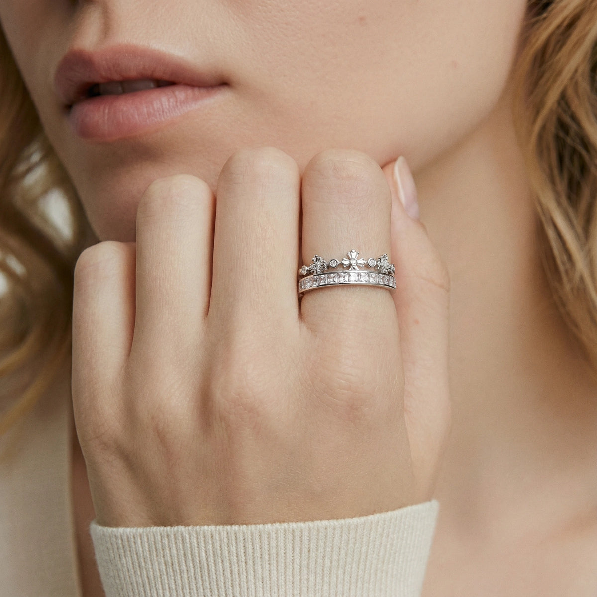 Royal Crown Ring: crown-shaped ring with princess-cut zirconia and small floral details across two bands